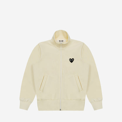 CDG Play Zip Track Jacket Black Heart Blanc cassé, vue de face, cœur noir brodé sur la poitrine