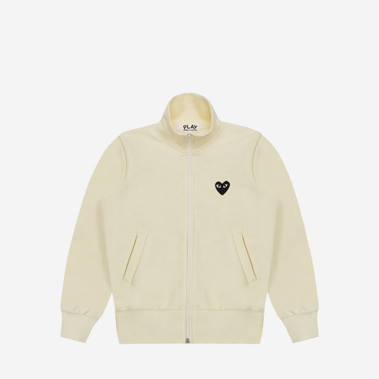 CDG Play Zip Track Jacket Black Heart Blanc cassé, vue de face, cœur noir brodé sur la poitrine